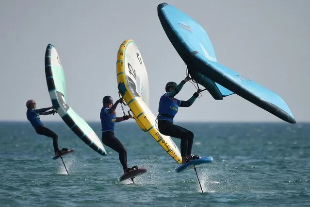 Competitors take part in one of the events of the first and only French stage of the GWA Wingfoil World Cup during the 25th edition of the “Mondial du Vent” event in Leucate, southern France, on April 29, 2022. The event runs from April 26, 2022 till May 1, 2022. (Photo by Valentine Chapuis/AFP Photo)