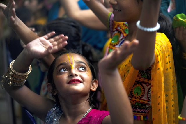 A Hindu girl dances during Janmashtami festival that marks the birthday of Lord Krishna at a temple in Jammu, India, Monday, August 26, 2024. (Photo by Channi Anand/AP Photo)