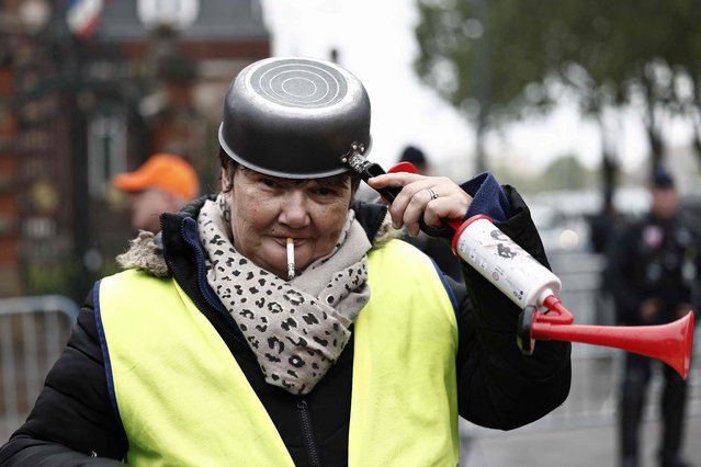 A pan-bashing protester demonstrates in front of subprefecture against French President's visit in Dunkirk, Northern France on May 12, 2023. (Photo by Sameer Al-Doumy/AFP Photo)