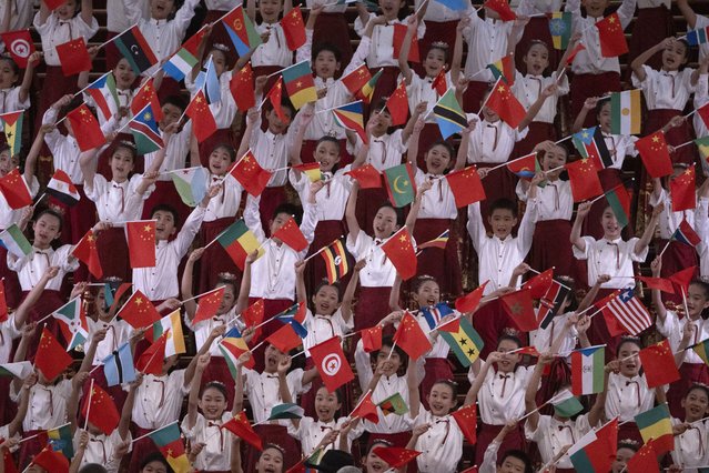 A group of children hold African and Chinese flags perform during a reception at the Forum on China-Africa Cooperation (FOCAC) in the Great Hall of the People in Beijing, China, 04 September 2024. (Photo by Andres Martinez Casares/EPA)