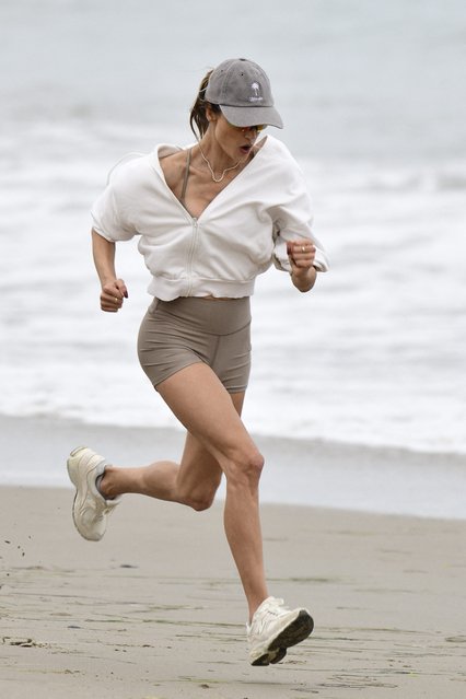 Brazilian model Alessandra Ambrosio is seen working out on the beach with a friend on October 10, 2024. (Photo by The Mega Agency)