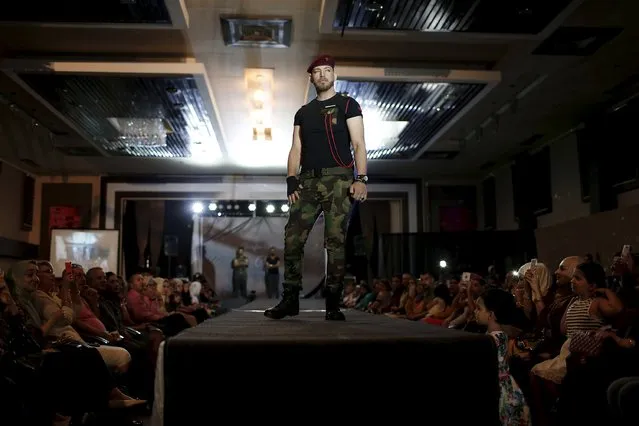 A model presents a creation by Iraqi designer Waffa Al-Shathar during a fashion show at the Hunting Club in Baghdad August 13, 2015. (Photo by Thaier al-Sudani/Reuters)