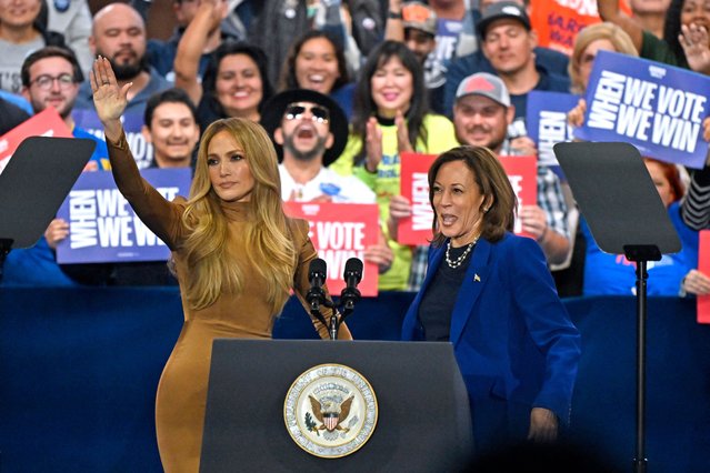 US singer Jennifer Lopez (L) greets US Vice President and Democratic presidential candidate Kamala Harris during a campaign rally at the Craig Ranch Amphitheater in Las Vegas, Nevada, on October 31, 2024. (Photo by David Becker/AFP Photo)