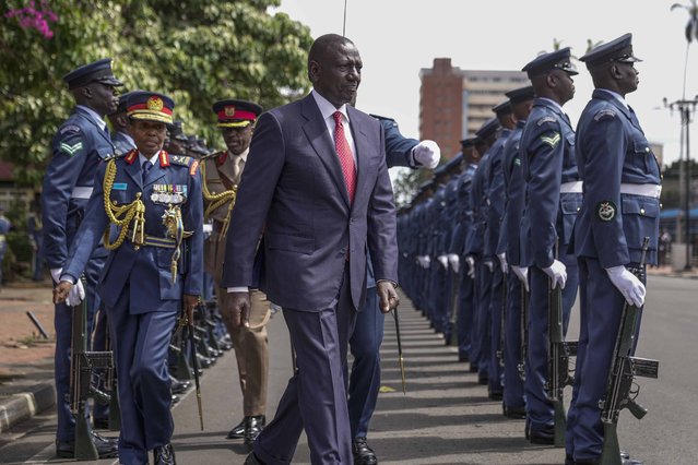 Kenyan President William Ruto, center, reviews the honour guard after arriving to give the State of The Nation address at Parliament buildings in Nairobi, Kenya, Thursday, November 21, 2024. (Photo by Brian Inganga/AP Photo)
