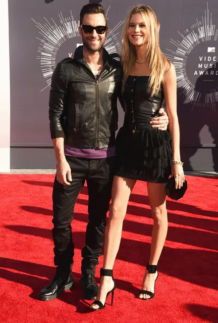 Recording artist Adam Levine (L) of Maroon 5 and model Behati Prinsloo attend the 2014 MTV Video Music Awards at The Forum on August 24, 2014 in Inglewood, California. (Photo by Steve Granitz/WireImage)