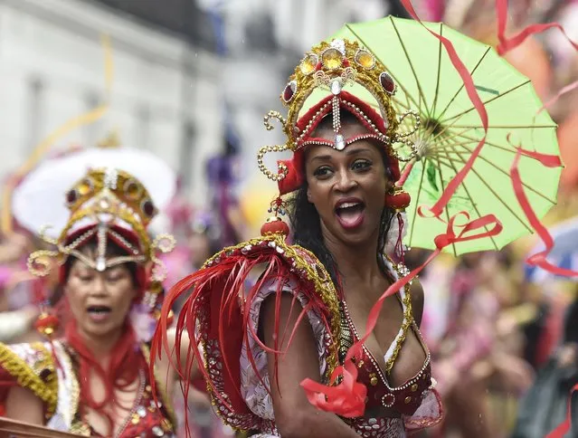 A reveller dances as she takes part in the Notting Hill Carnival in west London, August 25, 2014. (Photo by Toby Melville/Reuters)