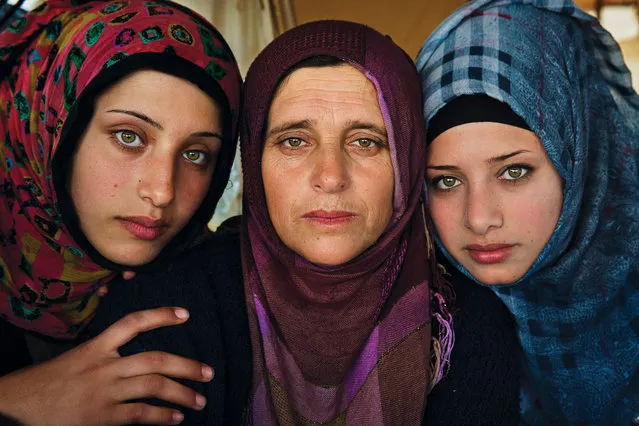 Greece: “This woman and her daughters fled the war in Syria”. (Photo by Mihaela Noroc/The Guardian)