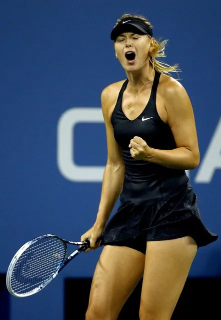 Maria Sharapova of Russia celebrates a point against Sabine Lisicki of Germany during their women's singles second round match on Day Five of the 2014 US Open at the USTA Billie Jean King National Tennis Center on August 29, 2014 in the Flushing neighborhood of the Queens borough of New York City. (Photo by Al Bello/Getty Images)