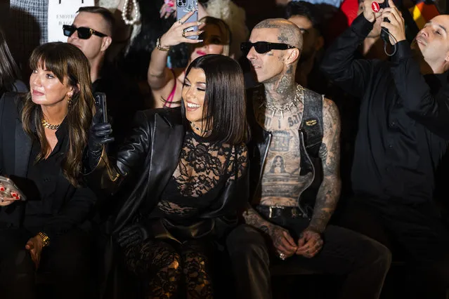 American media personality Kourtney Kardashian (L) and American musician Travis Barker attend the Boohoo X Kourtney Kardashian fashion show during New York Fashion Week: The Shows on the High Line on September 13, 2022 in New York City. (Photo by Gotham/GC Image)
