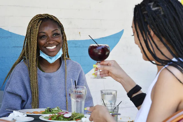 Dieyna Dieng, and her two friends, enjoy a light lunch and cocktails at Bistro Les Amis restaurant as New York City enters Phase II of the corona virus reopening of the city on June 22, 2020. (Photo by Matthew McDermott/The New York Post)