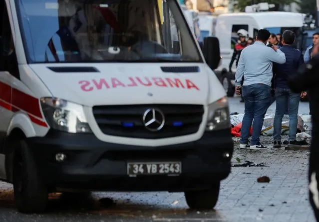 Bodies of unidentified people lay on the ground after an explosion on busy pedestrian Istiklal street in Istanbul, Turkey on November 13, 2022. (Photo by Kemal Aslan/Reuters)