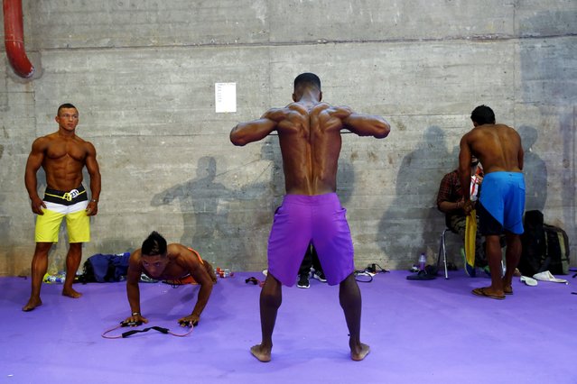 Competitors warm up backstage during the Arnold Classic Europe bodybuilding event in Madrid, Spain, September 25, 2015. (Photo by Susana Vera/Reuters)
