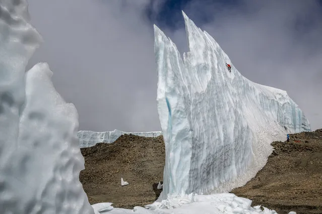 Will Gadd ice climbing near the summit at 19,000 feet on the glacier ice on Mount Kilimanjaro in Tanzania, Africa. (Photo by Christian Pondella/Red Bull/SWNS.com)