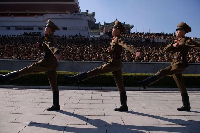 Members of a North Korean honour guard march past spectators prior to a mass military parade at Kim Il-Sung square in Pyongyang on October 10, 2015. (Photo by Ed Jones/AFP Photo)