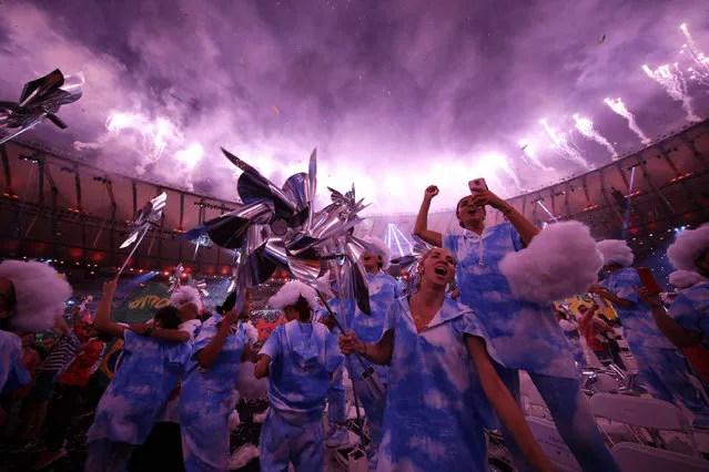 Performers celebrate at the end of the closing ceremony of the Rio 2016 Paralympic Games at the Maracana Stadium in Rio de Janeiro, Brazil, Sunday, September 18, 2016. (Photo by Leo Correa/AP Photo)