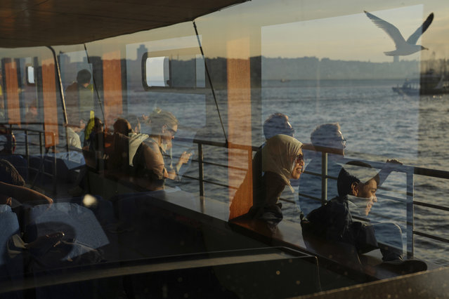 Passengers take a ride in a ferry crossing the Bosphorus in Istanbul, Turkey, Tuesday, May 27, 2025. (Photo by Francisco Seco/AP Photo)