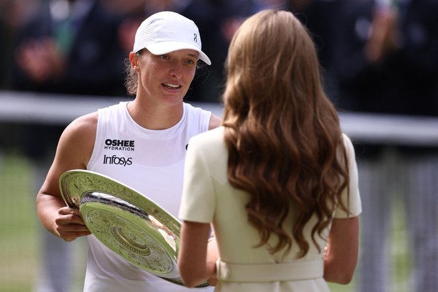 Britain's Catherine, Princess of Wales gives the winner's trophy, the Venus Rosewater Dish, to Poland's Iga Swiatek (L) after her victory against US player Amanda Anisimova at the end of their women's singles final tennis match on the thirteenth day of the 2025 Wimbledon Championships at The All England Lawn Tennis and Croquet Club in Wimbledon, southwest London, on July 12, 2025. (Photo by Henry Nicholls/AFP Photo)