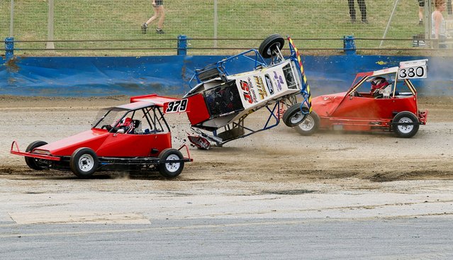 A crash occurs as racers take part in an I-Factor Fast and Furious short oval motorsport series meeting at Northampton Shaleway, in Northampton, Britain, on July 13, 2025. (Photo by Andrew Boyers/Reuters)
