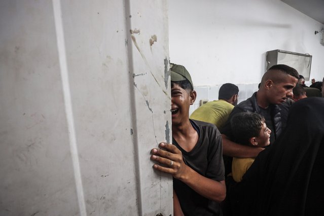 Relatives of Palestinians, who died as a result of the Israeli attack, attend the funeral ceremony after his body was taken from the Al-Shifa Hospital for burial in Gaza City, Gaza on June 30, 2025. (Photo by Abdalhkem Abu Riash/Anadolu via Getty Images)