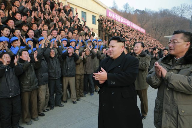 North Korean leader Kim Jong Un (C) visits the Kangdong Precision Machine Plant in this undated photo released by North Korea's Korean Central News Agency (KCNA) in Pyongyang January 16, 2015. (Photo by Reuters/KCNA)