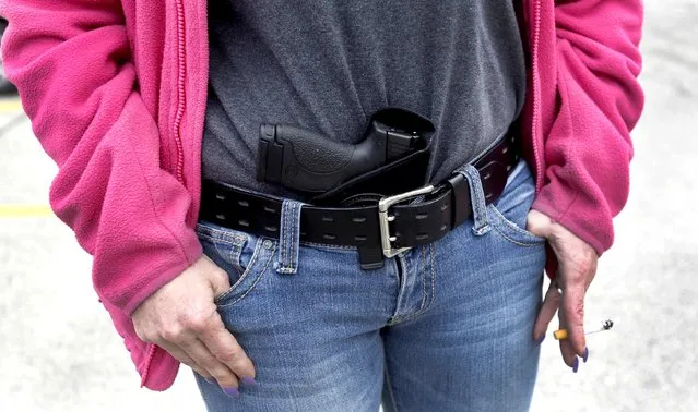 Gloria Lincoln-Thompson carries her 9mm Smith & Wesson pistol in her waistband during a rally in support of the Michigan Open Carry gun law in Romulus, Michigan, in this April 27, 2014 file photo. (Photo by Rebecca Cook/Reuters)