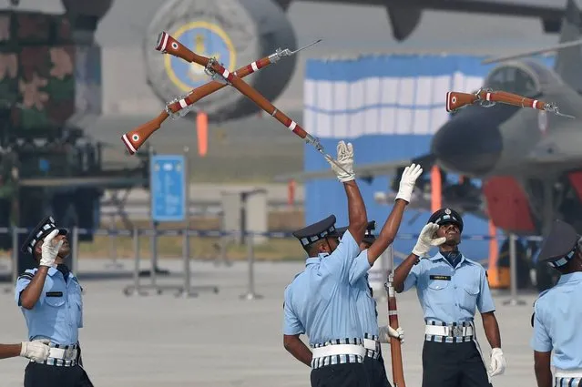 IAF personnel perform with their guns  during the 84th Air Force Day parade at Hindon Air Force base in Ghaziabad on Saturday, October 8, 2016. (Photo by Atul Yadav)
