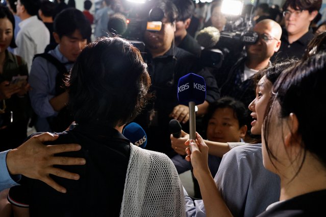 Members of the press interview a South Korean worker who was detained in a huge immigration raid last week at the site of a U.S. car battery project involving Hyundai Motor and LG Energy Solution in the U.S. state of Georgia, at the parking lot of the Incheon International Airport in Incheon, South Korea, on September 12, 2025. (Photo by Kim Soo-hyeon/Reuters)