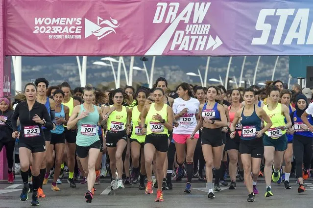 Women take part in the 9th edition of Women's Race 2023, a ten kilometer run in Beirut, Lebanon, 19 March 2023. Around 1,500 runners participated in the Women's Race under the slogan “Draw Your Path”. The event was organized to address all Lebanese women to keep moving forward and to rise to the challenges of every day. (Photo by Wael Hamzeh/EPA)