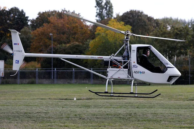 The Volta, an all electric helicopter takes off at the Paris Heliport in Issy-les-Moulineaux, France, October 19, 2016. The Volta helicopter has two motors, which are part of two segregated electric systems. Thanks to electric power, it is expected to be cheaper to operate. The concept is claimed to be more environmentally friendly. This is not only about reduced noise. Over an estimated 350-hour life, the Volta’s batteries save 17,000 liters (approximately 4,500 gallons) of fuel. For energy storage, the Volta is understood to use proven lithium-ion batteries. Unlike a combustion engine, the performance of an electric motor is not affected by hot temperature or high altitude. However, cold does impact the battery in the starting phase. The promoters of the Volta project assert this will not be a problem. (Photo by Regis Duvignau/Reuters)
