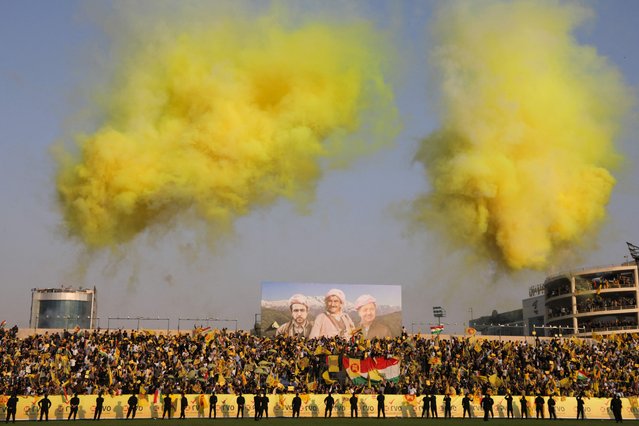 Iraqi Kurds wave flags as they attend an electoral campaign rally for the Kurdistan Democratic Party (KDP) at the Franso Hariri Stadium in Arbil on November 7, 2025 ahead of the country's parliamentary elections. Iraq will hold parliamentary elections on November 11. At least 25 percent of parliamentary seats must go to women, according to the quota system that also reserves nine seats for minorities. More than 7,700 candidates, nearly a third of whom are women, are running for election in the country of around 46 million people. (Photo by Safin Hamid/AFP Photo)