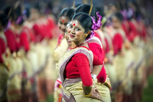 Assamese dancers in traditional attire perform as they attempt Guinness World Record in the largest folk dance performance category in Guwahati, India, Thursday, April 13, 2023. (Photo by Anupam Nath/AP Photo)