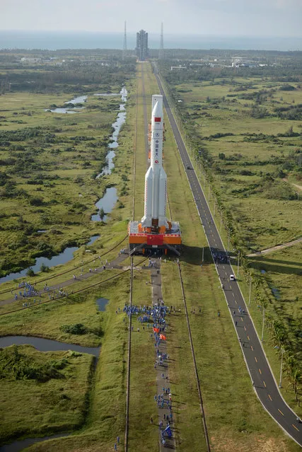 A Long March 5 carrier rocket is transferred to a launching area in Wenchang, Hainan Province, China, October 28, 2016. (Photo by Reuters/China Daily)