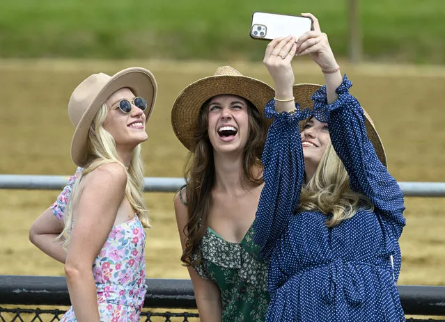 Friends (L-R) Katherine Olson, Olivia Carroll and Maron Ross take a memory during the 148th running of the Preakness Stakes at Pimlico Race Course on May 20, 2023. (Photo by Jonathan Newton/The Washington Post)