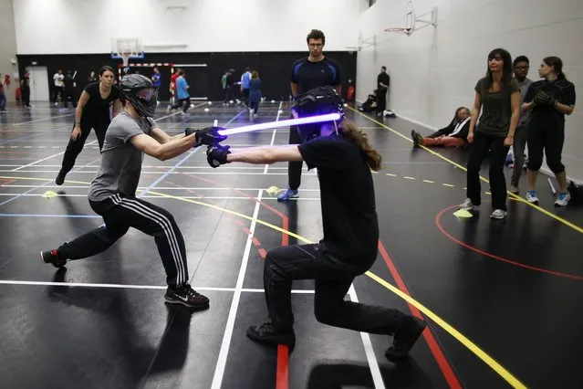 Competitors participate in a light saber duel tournament organized by the Sport Saber League in Paris, France, October 29, 2015. (Photo by Charles Platiau/Reuters)