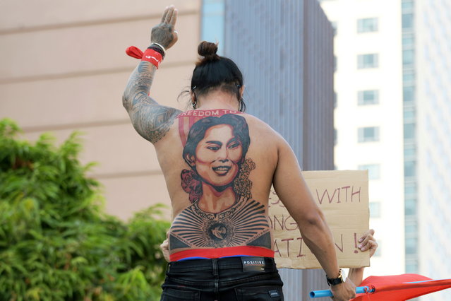A man with a tattoo of Aung San Suu Kyi takes part in a protest against the military coup and to demand the release of the elected leader in Yangon, Myanmar, February 8, 2021. (Photo by Reuters/Stringer)