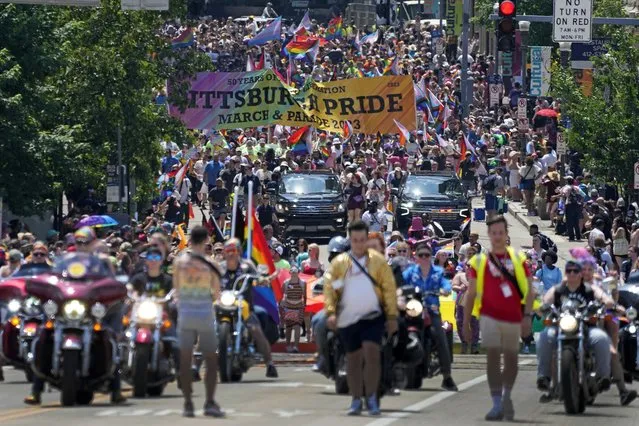 The Pittsburgh Pride parade, celebrating 50 years of Pittsburgh Pride, crosses the Andy Warhol Bridge from downtown Pittsburgh, Saturday, June 3, 2023. Longtime Pride sponsors have come under attack by conservatives for their LGBTQ-friendly marketing. (Photo by Gene J. Puskar/AP Photo)