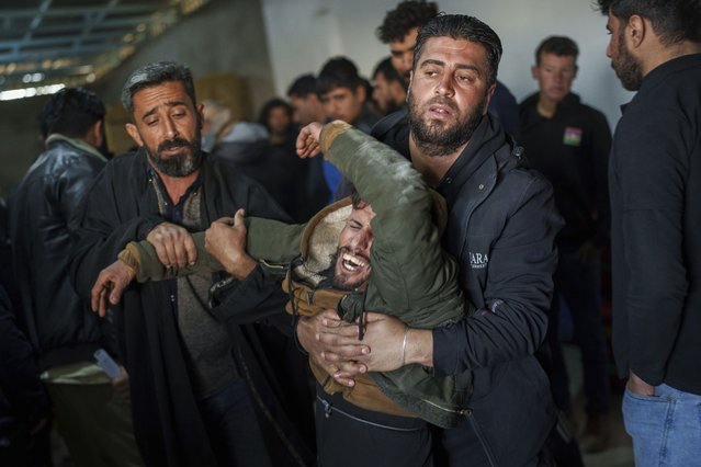 A man mourns during the death of Ibrahim al-Hamad, who was killed by a Turkish-backed militia, during the funeral of four Syrian Democratic Forces fighters in the village of Daoudiya in northeastern Syria's Hassakeh province, Wednesday, January 29, 2025. (Photo by Bernat Armangue/AP Photo)