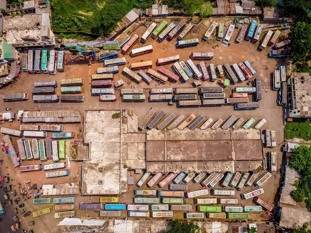 An aerial view of buses line up at the Barishal Central Bus Stand on April 6, 2021, one of the busiest bus-stand in the south region in Bangladesh, amid a week-long nationwide lockdown that began in Bangladesh on Monday to slow the spread of Covid-19. (Photo by Mustasinur Rahman Alvi/ZUMA Wire/Rex Features/Shutterstock)
