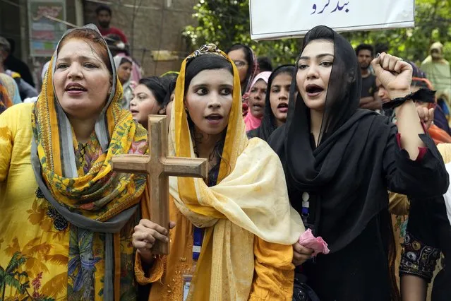 Christians women hold a demonstration condemning the recent attack on a Christian area by an angry Muslim mob, In Lahore, Pakistan, Sunday, August 20, 2023. (Photo by K.M. Chaudary/AP Photo)