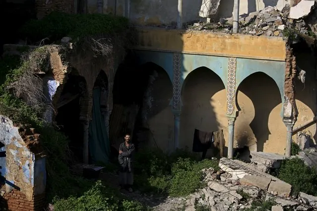 A man stands in a damaged moorish house in the old city of Algiers Al Casbah, Algeria December 13, 2015. (Photo by Zohra Bensemra/Reuters)