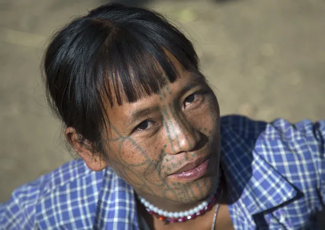 A woman from the Muun tribe who inhabit the hills of the Arakan state. The design, known as the letter B-pattern, is common in the Mindat area. It is composed of dots, lines and occasionally circles, in February, 2015, in Myanmar, Burma. (Photo by Eric Lafforgue/Barcroft Media)