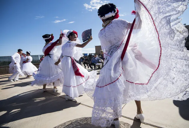 Dancers with the Mexico Vivo group prepares to perform at the East Las Vegas Community Center, an early voting location, in Las Vegas on Saturday, October 20, 2018, the first day of early voting in Nev. (Photo by Bill Clark/CQ Roll Call/Getty Images)