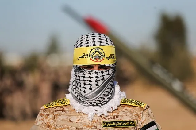 Palestinian Fatah militants hold an anti-Israel rally in Khan Younis, in the southern Gaza Strip on June 7, 2021. (Photo by Ibraheem Abu Mustafa/Reuters)