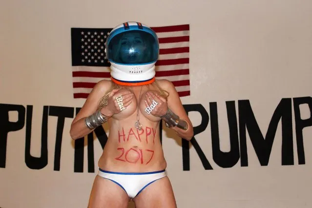 Nadeea Volianova the Russian Pop Star's bizarre, naked New Years “Art Installation” featuring an American flag, the named Putin and Trump in huge letters and the singer wearing a space helmet and not much else, Art Threat Gallery, Las Vegas, NV on December 29, 2016. (Photo by S_bukley/Splash News and Pictures)