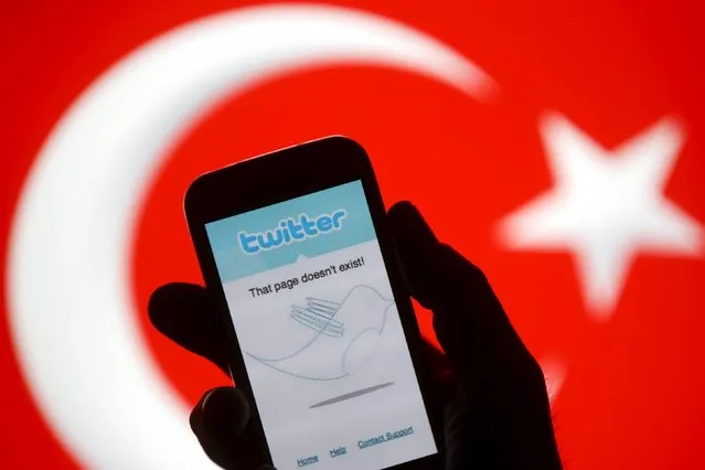 A person holds a Samsung Galaxy S4 displaying a Twitter error message in front of a Turkish national flag in this file picture illustration taken in Zenica on March 21, 2014. Turkey blocked access to Twitter and YouTube on April 6, 2015 over the publication of photographs of an Istanbul prosecutor held at gunpoint by far-left militants hours before he was killed in a shootout last week, officials said. (Photo by Dado Ruvic/Reuters)
