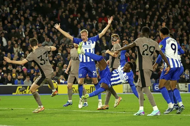 Brighton players successfully appeal for a penalty for a foul on Brighton's Danny Welbeck, center, during the English Premier League soccer match between Brighton & Hove Albion and Tottenham Hotspur at the Amex stadium in Brighton, England, Thursday, December 28, 2023. (Photo by Ian Walton/AP Photo)