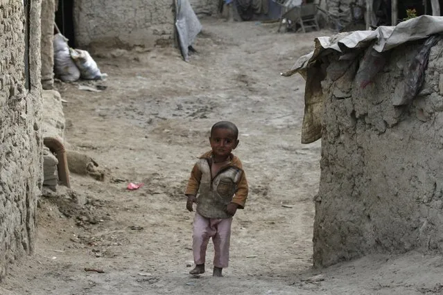 An Afghan refugee child walks near to his home in Kabul, Afghanistan, Thursday, April 16, 2015. (Photo by Allauddin Khan/AP Photo)