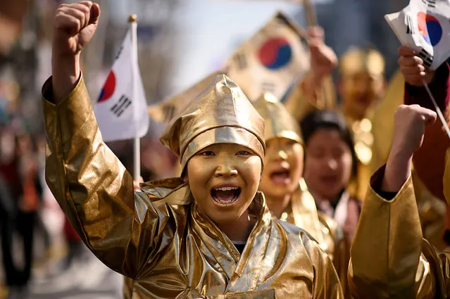Activists dressed as South Korean dissidents perform during an anti-Japan protest marking the 97th Independence Movement Day in Seoul on March 1, 2016. South Korea was marking the anniversary of the country's 1919 uprising against the 1910-1945 Japanese colonial rule. (Photo by Ed Jones/AFP Photo)