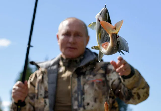 Russia's President Vladimir Putin fishing during a vacation. In early September, Putin spent a few days off in Siberia after his working visit to the Primorye Territory and the Amur Region, Russia on September 26, 2021. (Photo by Alexei Druzhinin/Russian Presidential Press and Information Office/TASS)