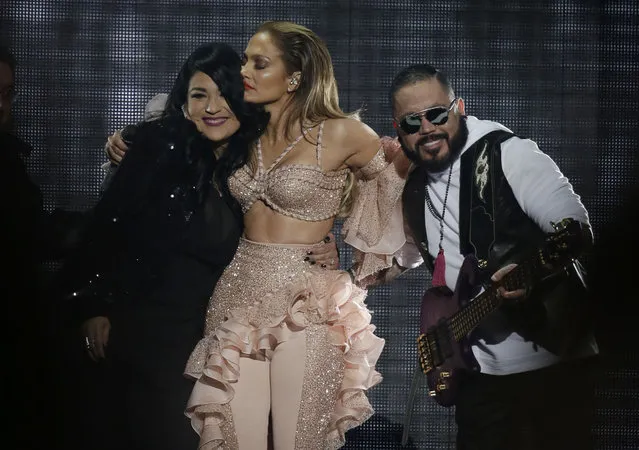 Jennifer Lopez hugs Suzette Quintanilla and A.B. Quintanilla, siblings of slain slinger Selena, during the Latin Billboard Awards Thursday, April 30, 2015, in Coral Gables, Fla. Lopez performed with Selena's band, which included the two siblings. (Photo by Lynne Sladky/AP Photo)